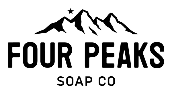 Logo of Four Peaks Soap Co. The design features black text and an illustration of mountains. The text "FOUR PEAKS SOAP CO" appears at the bottom in large bold typography.